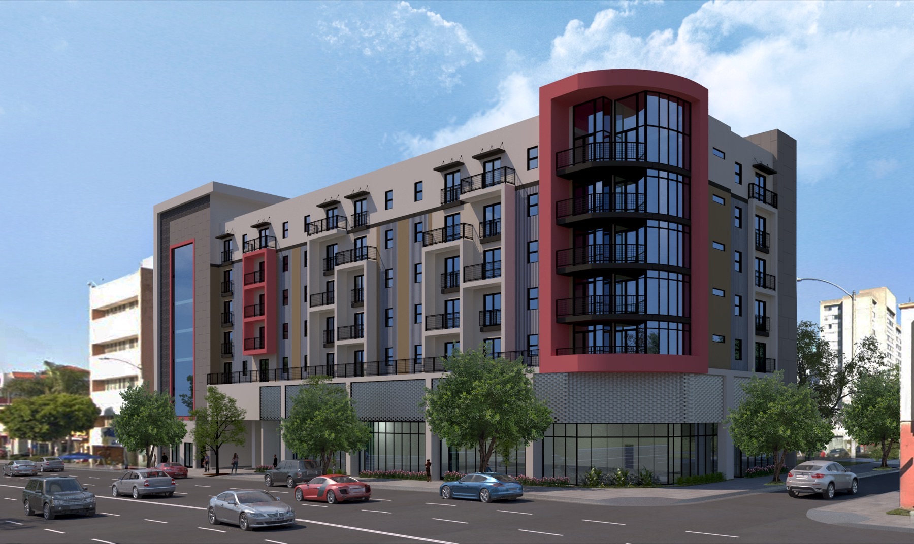 Rendering of a mixed-use apartment block with a curved red corner tower rising above ground-floor shopfronts, seen from across the street.